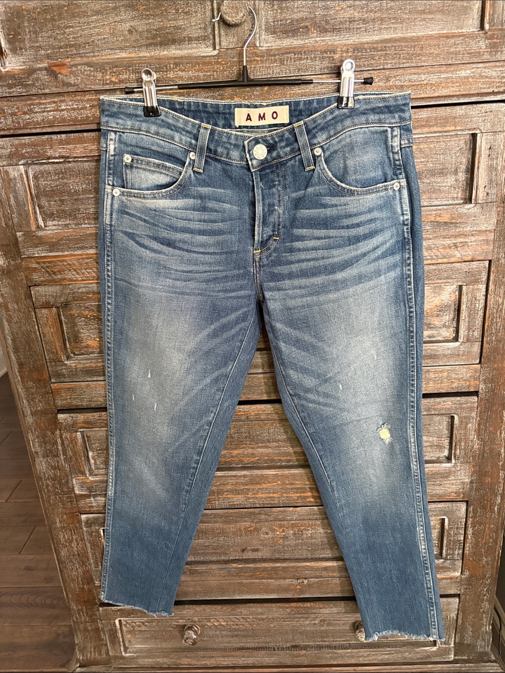 AMO Women’s Faded Blue Distressed Jeans